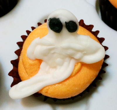 A white ghost cupcake topper